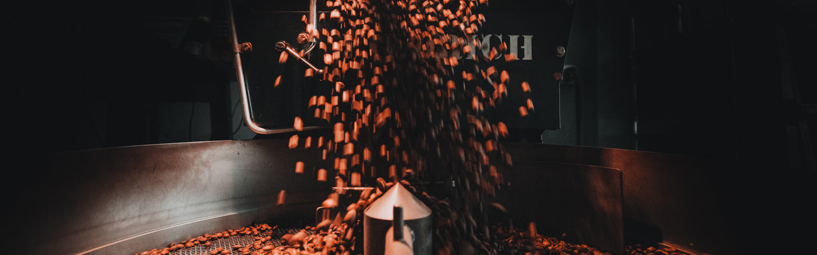 Coffee Beans Coming Out of Roaster